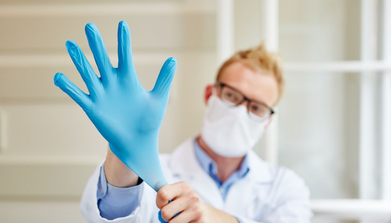 the doctor wears gloves for the massage to prevent prostatitis